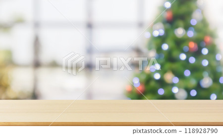 Empty table top with blurred Christmas tree with bokeh light background Empty table top with blurred Christmas tree with bokeh light background 118928790