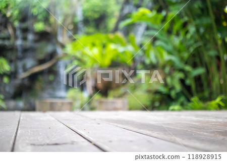 Empty wood table top with blur green tropical garden background for product display 118928915