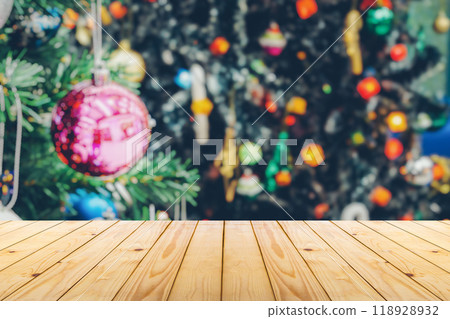 Empty wood table top with blur Christmas tree with bokeh light background Empty wood table top with blur Christmas tree with bokeh light background 118928932