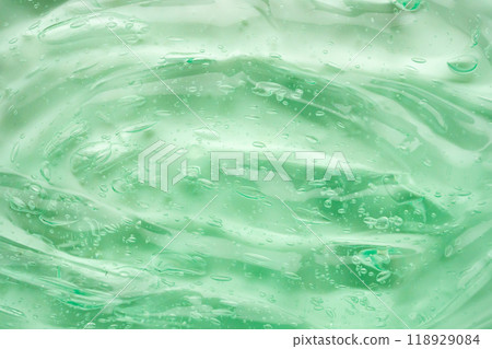Transparent clear green liquid serum gel cosmetic texture background 118929084