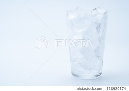 Glass with ice on white background Glass with ice on white background 118929174