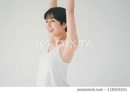 A woman who plays yoga with a smile A woman who plays yoga with a smile 118929291