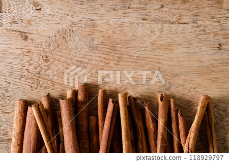 Dried Cinnamomum cassia on wooden table. Dried Cinnamomum cassia on wooden table. 118929797
