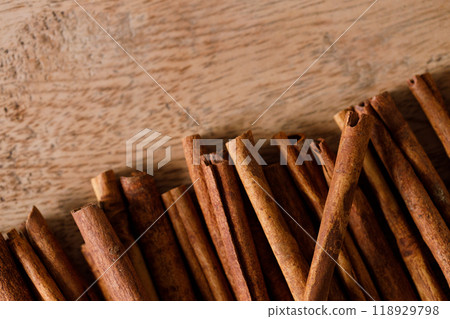 Dried Cinnamomum cassia on wooden table. Dried Cinnamomum cassia on wooden table. 118929798