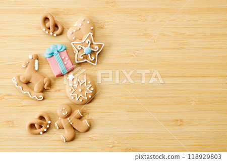 Christmas homemade gingerbread cookies on wooden table. 118929803