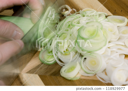 Scene of cutting green onions with a knife Scene of cutting green onions with a knife 118929977