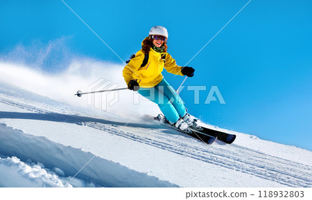Skier gliding down the slope Skier gliding down the slope 118932803