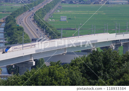 View of the Hokuriku Shinkansen and Hokuriku Expressway from Mt. Iwanai, Echizen City, Fukui Prefecture 118933384