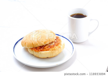 A ham cutlet sandwich on Kaisersemmel, a bread roll originating from Austria, and freshly brewed coffee A ham cutlet sandwich on Kaisersemmel, a bread roll originating from Austria, and freshly brewed coffee 118933894