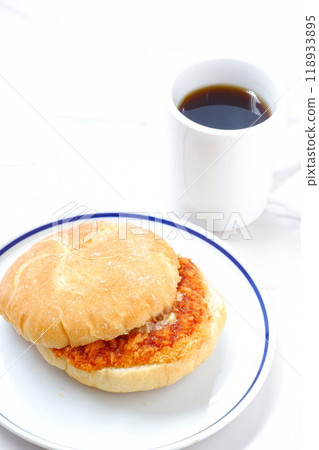 A ham cutlet sandwich on Kaisersemmel, a bread roll originating from Austria, and freshly brewed coffee A ham cutlet sandwich on Kaisersemmel, a bread roll originating from Austria, and freshly brewed coffee 118933895