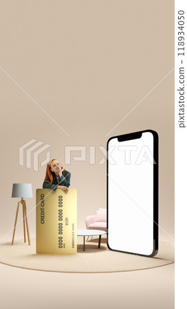 Smiling young woman leaning on giant credit card in living room , promoting online financial services. 3D model of phone with blank screen Smiling young woman leaning on giant credit card in living room , promoting online financial services. 3D model of phone with blank screen 118934050