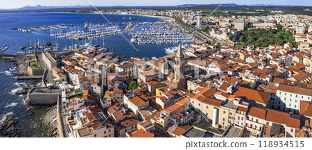 Sardegna (Sardinia) island landmarks. Charming historic Alghero. Aerial drone panoramic view of marine and old town Sardegna (Sardinia) island landmarks. Charming historic Alghero. Aerial drone panoramic view of marine and old town 118934515