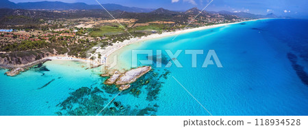 Italy. Sardegna island best scenic beaches . Costa Rei in the south , famous for white sandy beaches and turquoise crystal sea. Scoglio di Peppino beach Italy. Sardegna island best scenic beaches . Costa Rei in the south , famous for white sandy beaches and turquoise crystal sea. Scoglio di Peppino beach 118934528