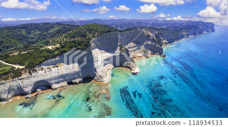 Ionian islands of Greece Corfu. Panoramic aerial view of stunning Cape Drastis - natural beuty landscape with white rocks and turquoise waters Ionian islands of Greece Corfu. Panoramic aerial view of stunning Cape Drastis - natural beuty landscape with white rocks and turquoise waters 118934533