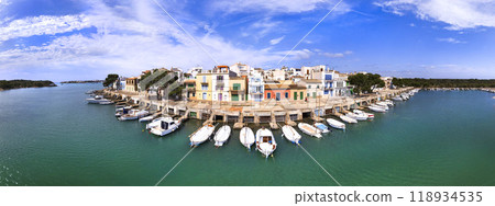 Mallorca island landmarks. Scenic fishing village Portocolom with colorful houses and boats . Popular tourist destination. Balears, Spain Mallorca island landmarks. Scenic fishing village Portocolom with colorful houses and boats . Popular tourist destination. Balears, Spain 118934535