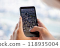 A person taking a photo using a smartphone 118935004