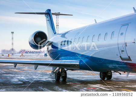 The rear of the passenger aircraft in a cold winter airport 118936052