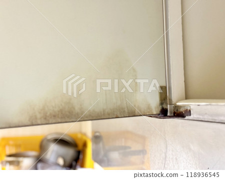 Dirty inside of kitchen cupboard 118936545