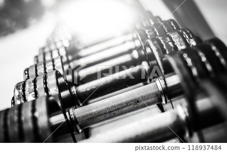 metallic dumbbells in a row metallic dumbbells in a row 118937484