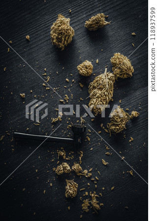 Dry CBD cannabis with metal smoking pipe Dry CBD cannabis with metal smoking pipe 118937599