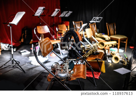 Saxophones on chairs in concert hall stage Saxophones on chairs in concert hall stage 118937613