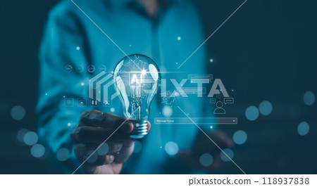 AI Artificial Intelligence Technology concept. Businessman holding a glowing lightbulb with "AI" symbol, representing artificial intelligence technology, innovation, and future digital advancements. AI Artificial Intelligence Technology concept. Businessman holding a glowing lightbulb with "AI" symbol, representing artificial intelligence technology, innovation, and future digital advancements. 118937838
