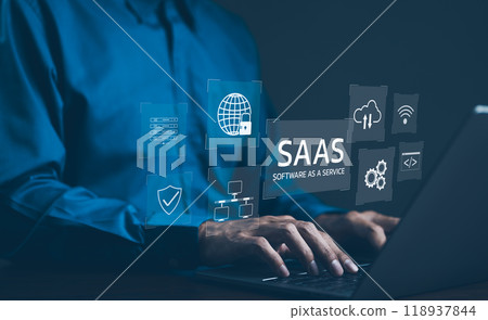 SaaS Concept, Software as a Service, A man types on laptop with digital icons representing various aspects of Software as a Service (SaaS), emphasizing modern technology platforms and cloud computing. SaaS Concept, Software as a Service, A man types on laptop with digital icons representing various aspects of Software as a Service (SaaS), emphasizing modern technology platforms and cloud computing. 118937844
