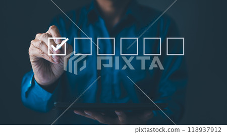 Checklist Concept with Businessman and Check Mark. A businessman marking a check on a virtual checklist, representing task completion and organization in a professional business setting. filling out, 118937912