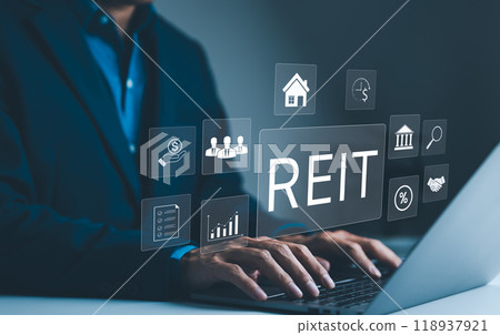 REIT, Real Estate Investment Trust Concept. A businessman works on a laptop with icons representing Real Estate Investment Trust, various aspects of real estate investments, and financial management. 118937921