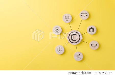 Digital Copyright and Patent Concept. Wooden blocks with various icons including a copyright symbol, light bulb, scale, handshake, and certification, on yellow background, copyright, patent concepts, Digital Copyright and Patent Concept. Wooden blocks with various icons including a copyright symbol, light bulb, scale, handshake, and certification, on yellow background, copyright, patent concepts, 118937942