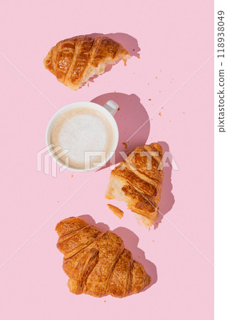 Flat lay of coffee cup and fresh croissants on pink  background with shadow. 118938049