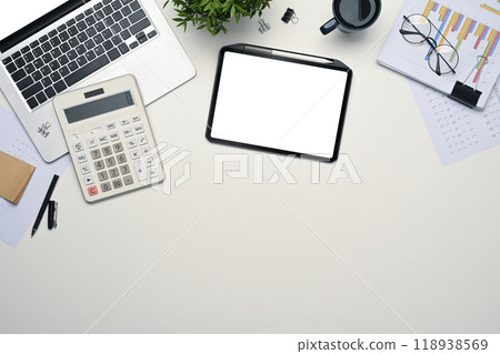 Top view digital tablet, laptop, calculator and document on white desk 118938569