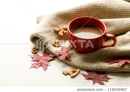 Hot chocolate drink in a red cup. Autumn Winter composition Hot chocolate drink in a red cup. Autumn Winter composition 118939967