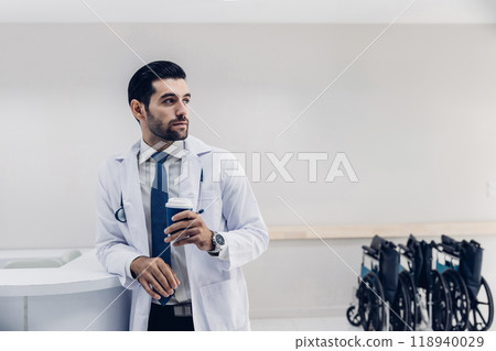 doctor in white coat Standing using cellphone applications in clinic office. Man with healthcare, medical and wellness app on mobile technology or search internet doctor in white coat Standing using cellphone applications in clinic office. Man with healthcare, medical and wellness app on mobile technology or search internet 118940029