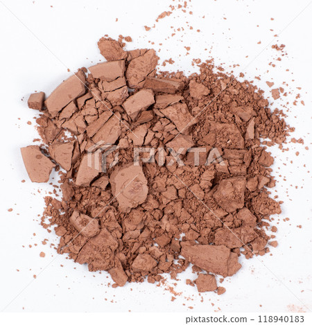 Scattered brown eyeshadow on a white background. Eye shadow texture Scattered brown eyeshadow on a white background. Eye shadow texture 118940183