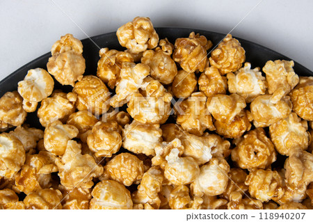 Sweet caramelized popcorn top view close up Sweet caramelized popcorn top view close up 118940207