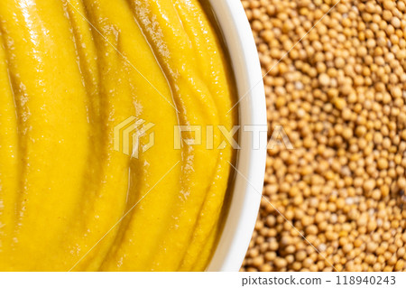 Mustard sauce and dry mustard seeds, top view. Mustard sauce and dry mustard seeds, top view. 118940243
