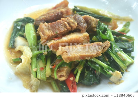 fried Chinese kale and cabbage with crispy pork in soy sauce on plate  118940603