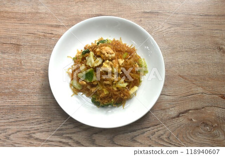 fried glass noodles with egg and cabbage in black sweet soy sauce on plate fried glass noodles with egg and cabbage in black sweet soy sauce on plate 118940607