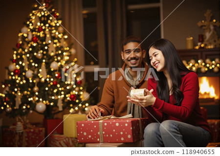A couple happily celebrating Christmas at home. 118940655