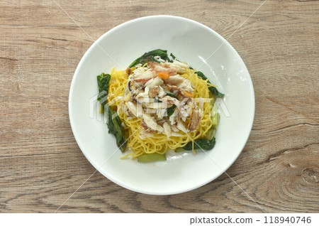 Chinese egg yellow noodles topping crab meat on plate Chinese egg yellow noodles topping crab meat on plate 118940746