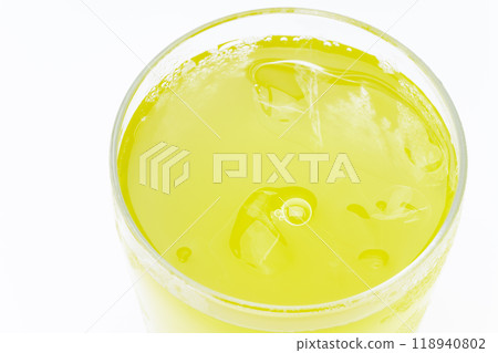 Close-up of the surface of cold green tea in a glass Close-up of the surface of cold green tea in a glass 118940802