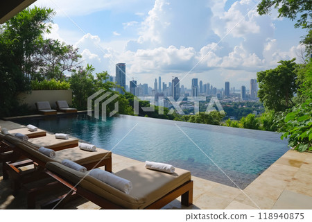 A swimming pool with lounge chairs and a view of the city 118940875