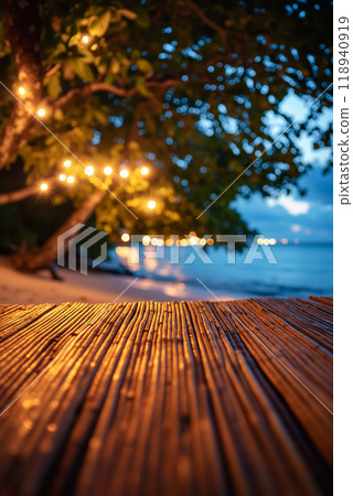 A wooden table sitting on top of a wooden floor next to a beach 118940919