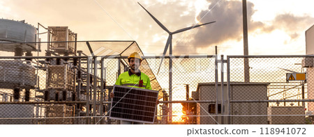 Professional Man Energy Engineer Holding the Solar Panel. Alternative energy engineers hold solar panels samples while learning design Professional Man Energy Engineer Holding the Solar Panel. Alternative energy engineers hold solar panels samples while learning design 118941072