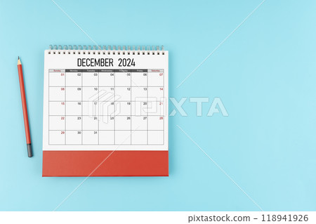 December desk calendar for 2024 year with pencil on blue background, Position with copy space. December desk calendar for 2024 year with pencil on blue background, Position with copy space. 118941926