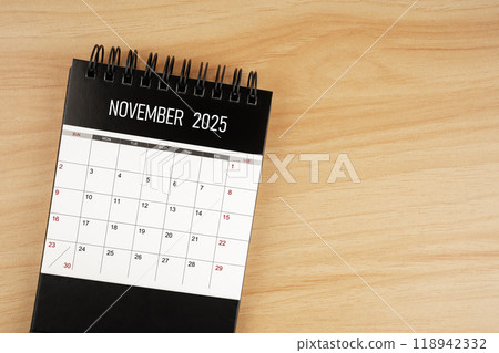 November desk calendar for 2025 year on wooden floor. November desk calendar for 2025 year on wooden floor. 118942332