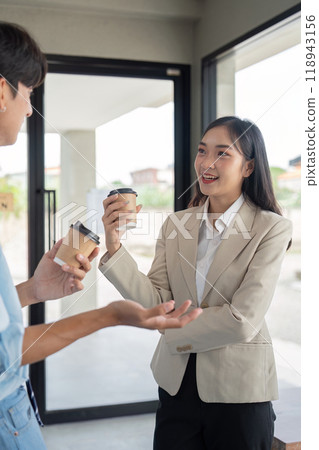 Business Duo Enjoying Coffee in Cafe While Discussing Projects. Concept of Work-Life Integration and Networking Business Duo Enjoying Coffee in Cafe While Discussing Projects. Concept of Work-Life Integration and Networking 118943156