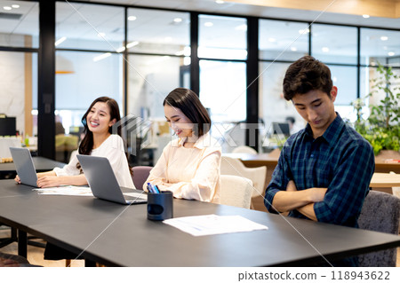 Two people looking down with their arms folded thinking and a smiling person Two people looking down with their arms folded thinking and a smiling person 118943622
