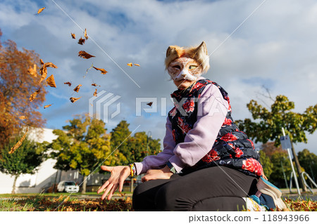 Cute young little kid girl wear cat furry mask enjoy have fun playing outdoors in forest street park. Children therian wild animal character trendy fan culture. Teenager social expression hobby Cute young little kid girl wear cat furry mask enjoy have fun playing outdoors in forest street park. Children therian wild animal character trendy fan culture. Teenager social expression hobby 118943966